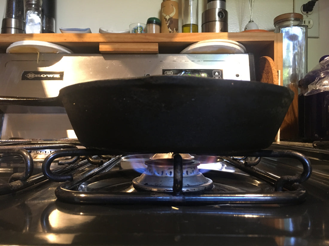 recommended stove setting and flame height for roasting coffee at home in a cast iron pan